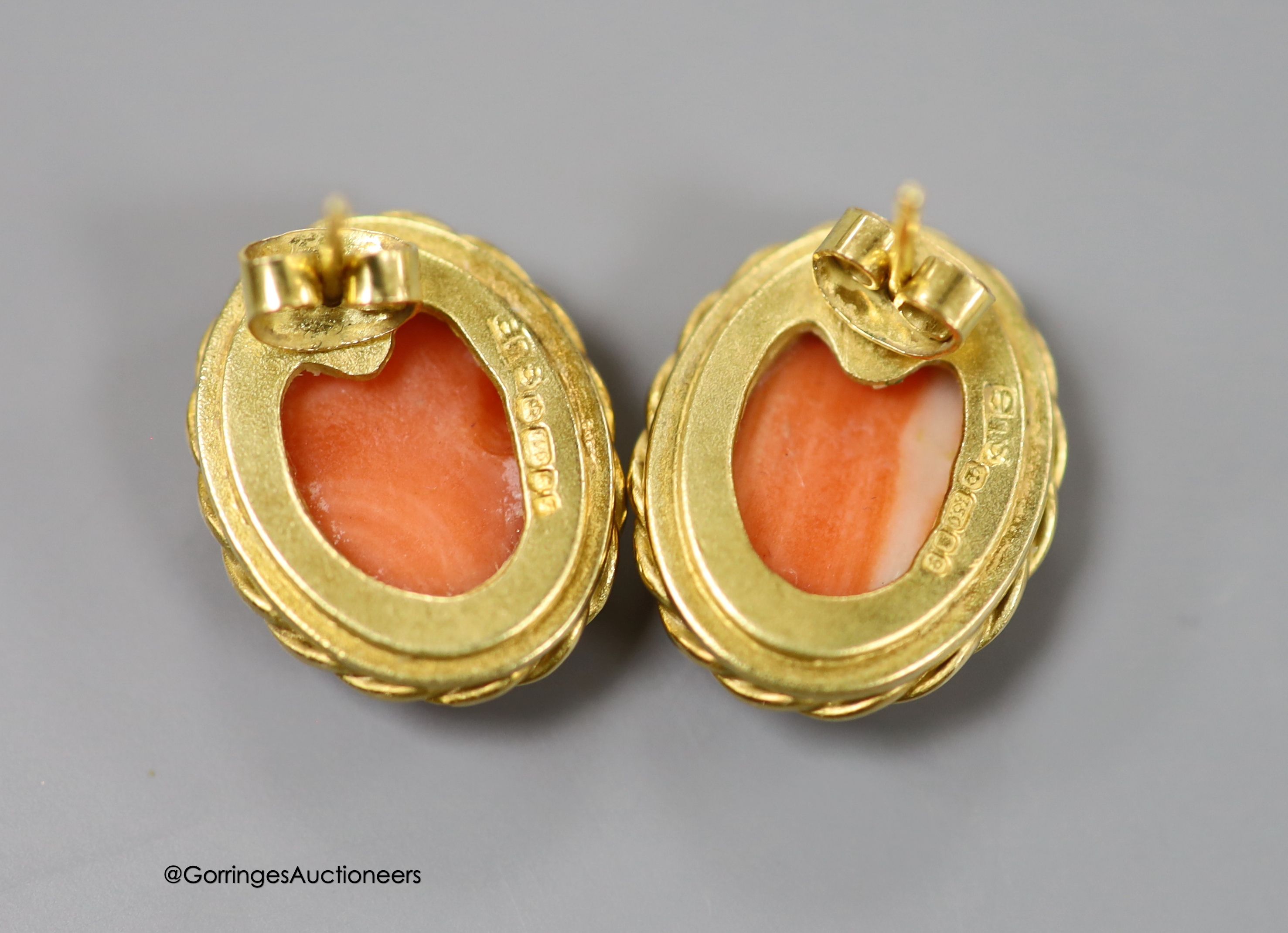 A modern pair of 18ct gold and fluted oval coral bead set earrings, 20mm, gross weight 12 grams.